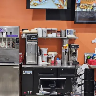 a kitchen with a fridge and a counter