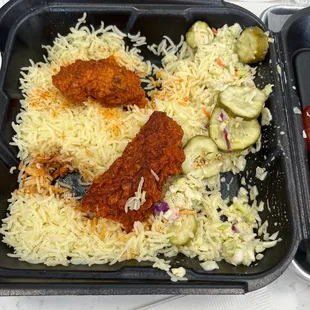 Eating chicken tenders with rice