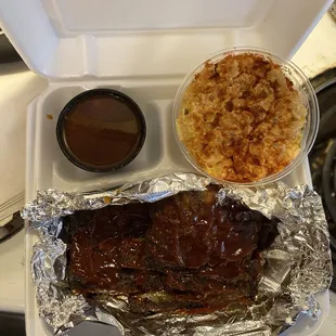 Ribs , baked beans , and potato salad