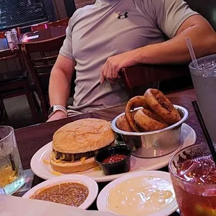 a man sitting at a table full of food