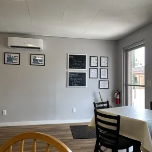 a dining room with a table and chairs