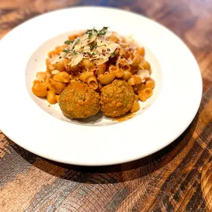 a plate of pasta and meatballs