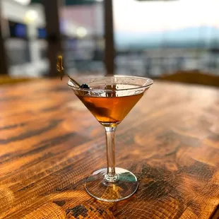 a martini on a wooden table