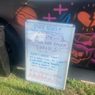 a sign in front of a truck