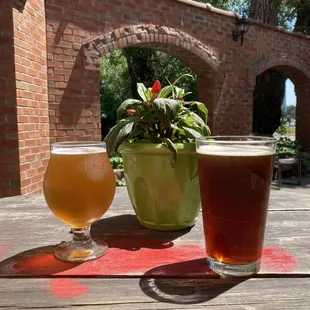 two glasses of beer on a table