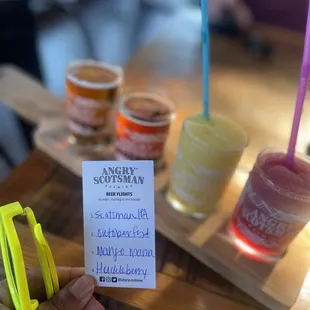 a person holding up a drink