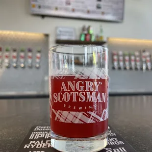 a pint glass on a bar