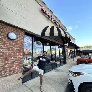 Handsome man and front of restaurant