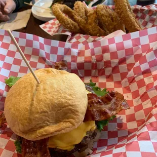 Deluxe bacon cheese burger and onion rings and lettuce wrap! Yum