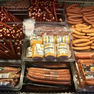a display of sausages and hot dogs
