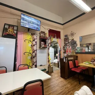 a dining area with tables and chairs