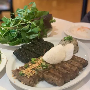 Bo Mo Chai (grilled beef sausage), Bo Nuong La Lot (w/ betel leaf), Bo Nuong Xa (stuffed onion and lemongrass), and steamed beef Patty