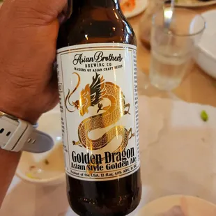 a bottle of golden dragon beer