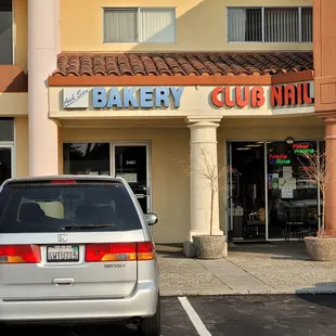 a car parked in front of a bakery
