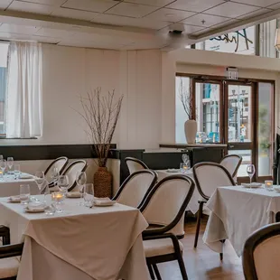 a dining room with tables and chairs