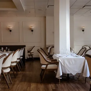 a dining room with tables and chairs