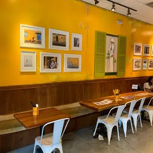 a long table with white chairs