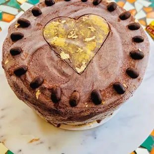 A 6 inch 2 layer vegan cake. 2 layers of chocolate cake with coffee buttercream and chocolate ganache. YUM!