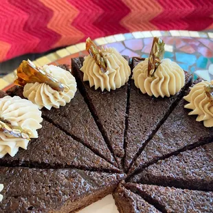 Ginger spice cake made with molases and guiness beer. Decorated with coffee buttercream and pumpkin brittle. As decadent as it sounds