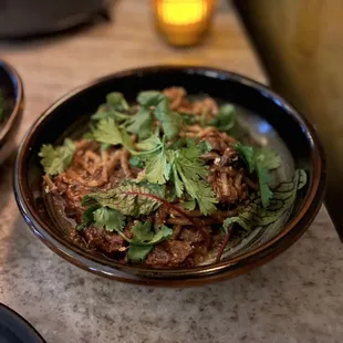 SPICY CUMIN LAMB NOODLE lamb ragu, parmesan, cilantro breadcrumbs