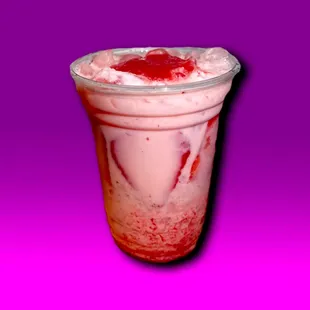 a strawberry milkshake in a plastic cup