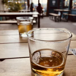 a glass of whiskey on a table