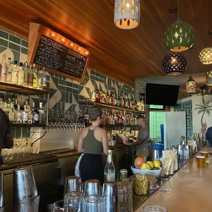 a bar with people at the bar