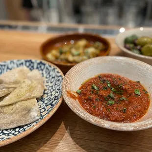 Matbucha - roasted bell peppers, onion sofrito, paprika, and melted tomatoes.  Served with homemade pita bread.