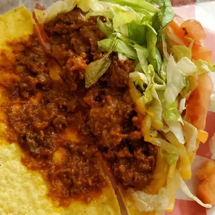 an opened up crunchy taco for a photo