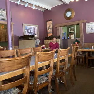 people sitting at tables in a restaurant