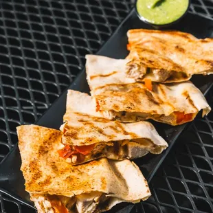 Chicken Pita Quesadilla - Chicken, peppers, onions, mozzarella, provolone, between pita bread, grilled until crispy. (soy-free, halal)