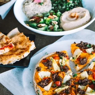 Arabian Pizza - 
A great vegan entrée or perfect for sharing! Includes hommus, tabbouleh, fattoush, and baba ghannouge. (vegan, soy-free)