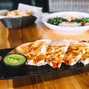 Chicken Pita Quesadilla - Chicken, peppers, onions, mozzarella, provolone, between pita bread, grilled crispy. (soy-free, halal)