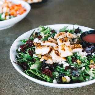 Michigan Salad - Mixed greens, blue cheese, roasted pistachios, michigan cherries, grilled chicken, with pom vin, (gluten-free, halal)