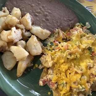Migas with Cheese, potatoes and refried beans. The Migas were totally on point!!