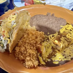 One puffy taco, one cheese enchilada, rice and beans