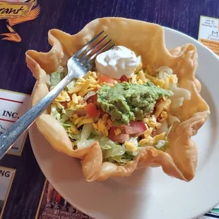 Taco salad with beef fajita, on the bottom. $9.99