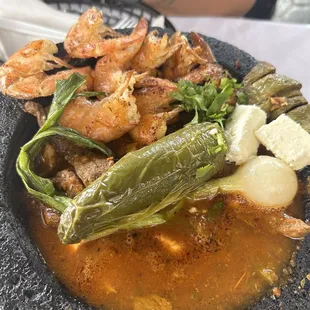 a plate of seafood and vegetables