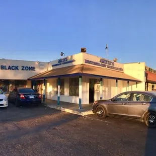 cars parked in front of the restaurant