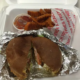 Voodoo sandwich on wheat bun with sweet potato fries. Amazing!