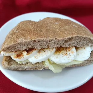 House-baked long-fermented bread (wheat berries milled shortly before baking) as a 1/2 sandwich witch pastured boiled egg.
