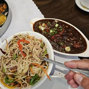 Burnt garlic noodles with chicken  and chicken manchurian gravy. Authentic and heavenly!