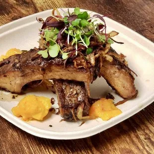 a plate of food on a wooden table