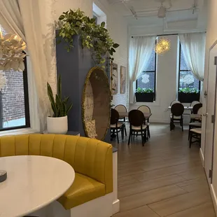 a dining room with a table and chairs