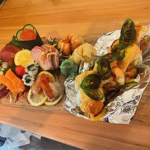 a plate of sushi and vegetables