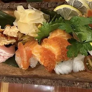 a platter of different types of sushi