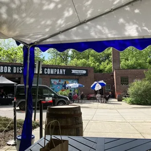 an outdoor area with tables and umbrellas