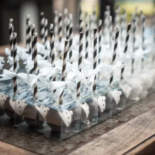 50 bride and groom cake pops, red velvet flavored. We opted for individually wrapped boxes. They turned out beautiful and delicious!
