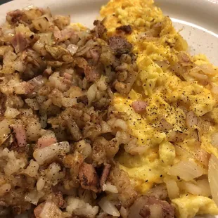 Hash browns with cheese ham and onions and scrambled eggs with cheese and onions.
