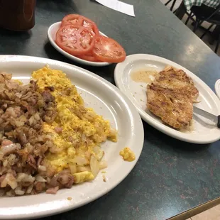 Grilled chicken, hash browns with ham cheese and onion.